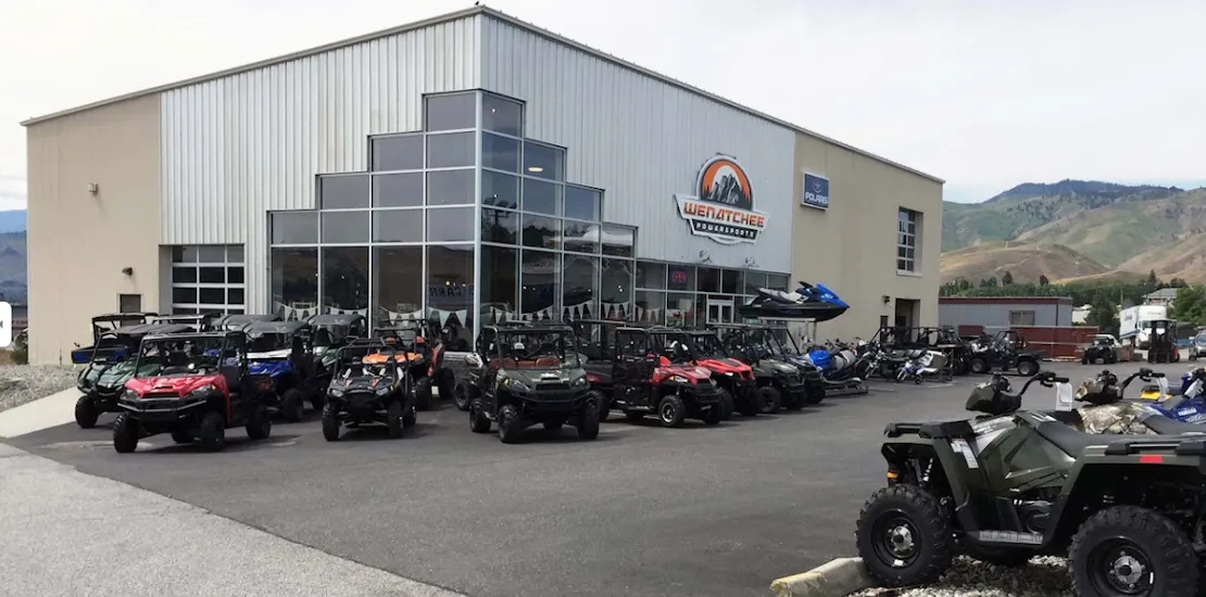 The wenatchee physical shop with a lot of carts on the front, showing its amazing variety of vehicles